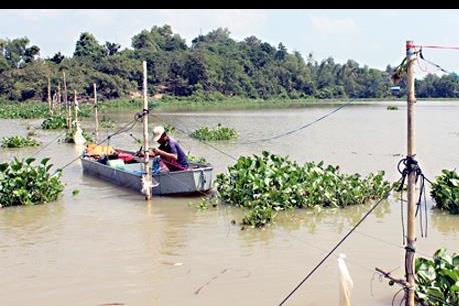 Dân tự tháo dỡ hết đăng chắn trái phép trên hồ Trị An