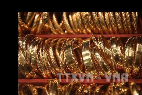 Đà tăng của USD gây sức ép lên giá vàng thế giới
