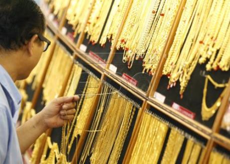 Giá vàng dịu xuống khi đồng USD tăng lên mức cao nhất trong 14 năm