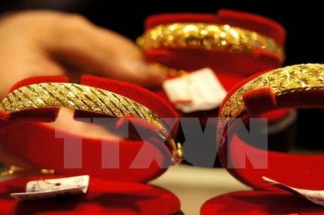 Giá vàng thế giới giảm xuống mức thấp trong ba tuần