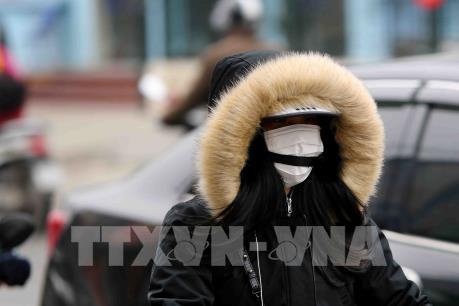 Chùm ảnh người dân ở Hà Nội chống chọi với thời tiết giá rét