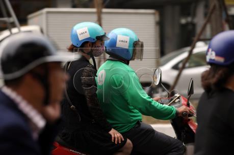 Những mối lo từ thương vụ tỷ đô Grab - Uber