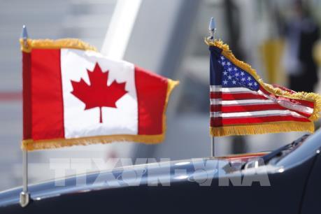 Mỹ và Canada giải quyết được mâu thuẫn về thị trường sữa và thuế ô tô