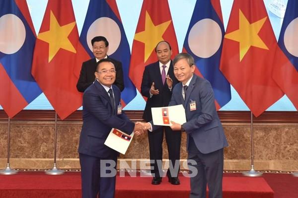 EVN ký nhiều biên bản ghi nhớ phát triển dự án và mua điện từ Lào