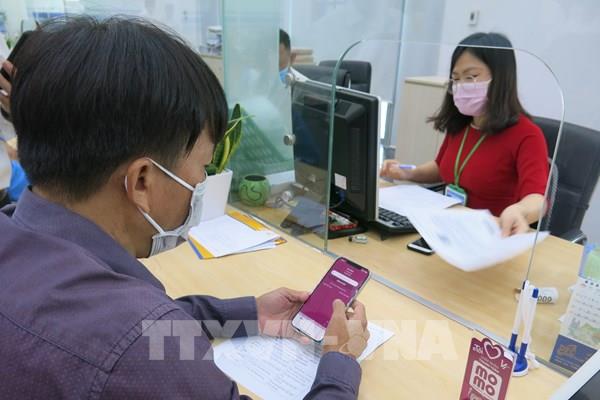 Bình Dương: Thanh toán không dùng tiền mặt khi giải quyết thủ tục hành chính công