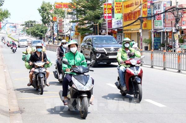 Tp. Hồ Chí Minh cho phép shipper hoạt động tại "vùng đỏ"