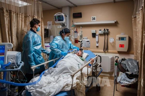 WHO: Thế giới có thể sẽ phải sống chung với COVID-19