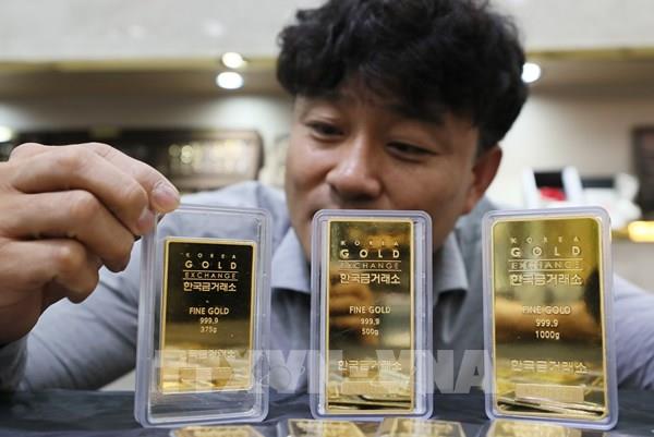 Đồng USD mạnh lên kéo giá vàng đi xuống