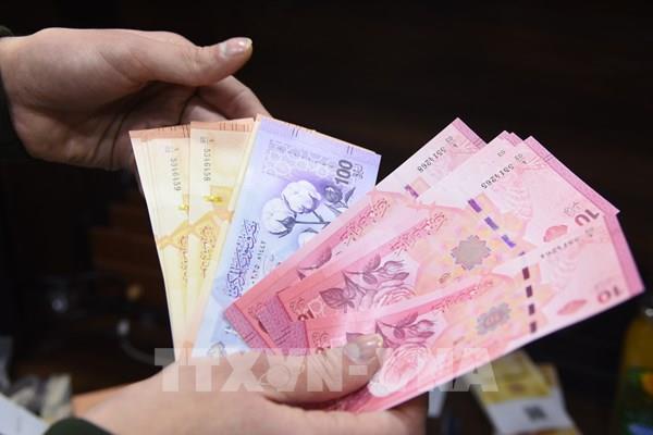 Syria bắt đầu đổi tiền