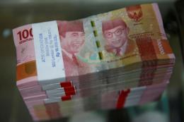 Đồng rupiah Indonesia rớt giá sau các cuộc bạo loạn Đồng rupiah Indonesia rớt giá sau các cuộc bạo loạn